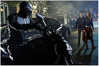 Supergirl Melissa Benoist as Supergirl and Chris Wood as Mon-El in street with villain on motorcycle 8 x 10 Inch Photo