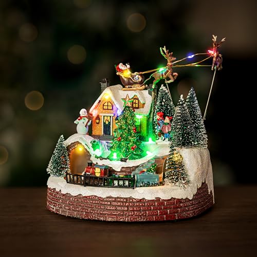 Marco Paul Christmas Decoration Musical Light Up Village Scene with Moving Train and Santa Sleigh - LED Santa & Reindeer Decoration, Polyresin Festive Ornament (Santa and Train)