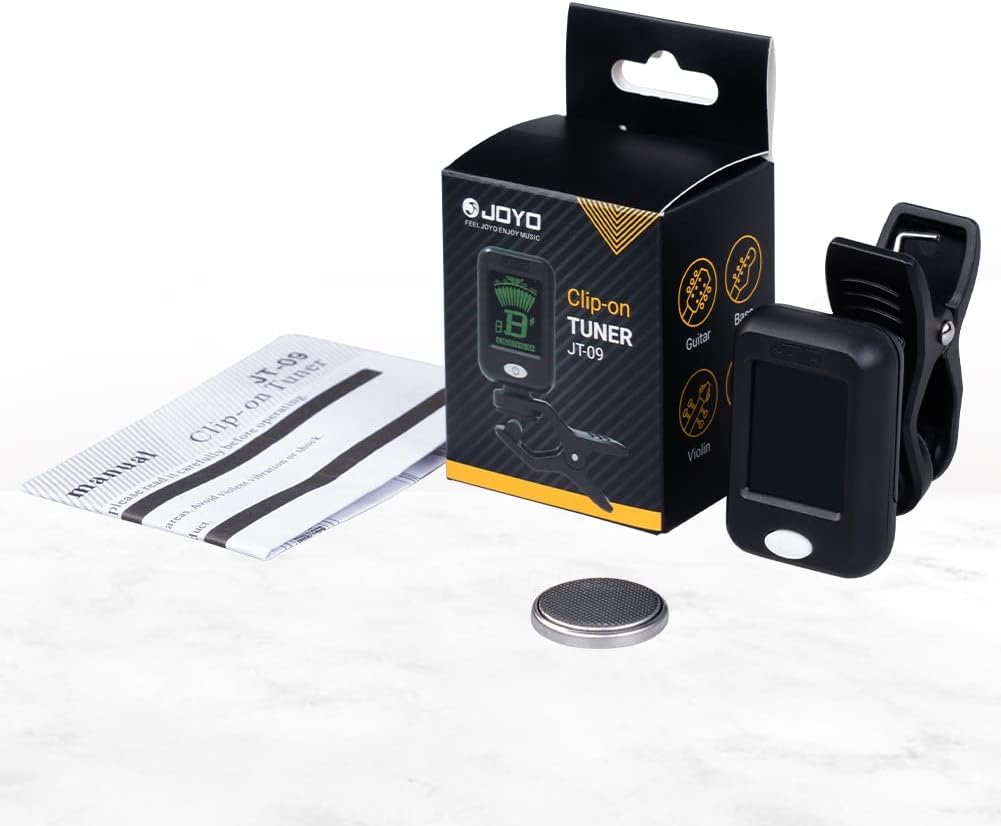 Contents of the JOYO JT-09 tuner package, including the tuner, manual, and battery.