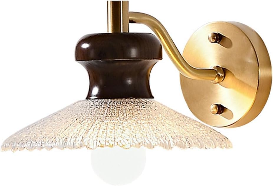 Luz de pared de vidrio transparente y metal dorado para una iluminación limpia en el dormitorio