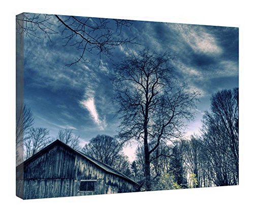 Toile forêt bleue sous cadre bois pour une ambiance salon cosy unique