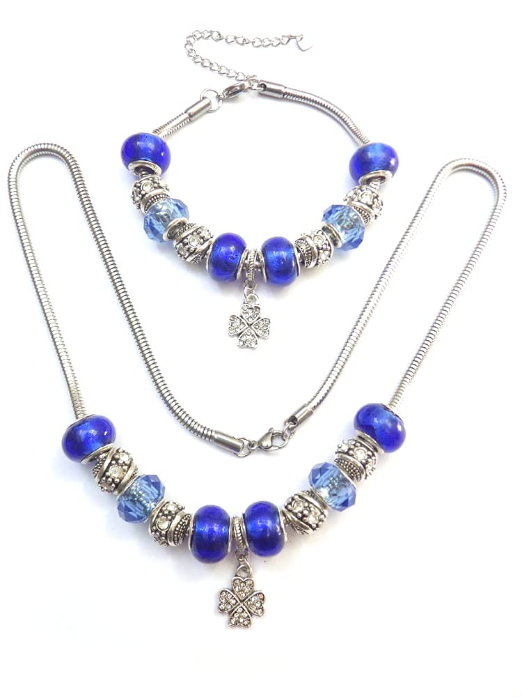 Parure mujer de acero inoxidable con collar charms pulsera a juego y colgante trébol con cristales