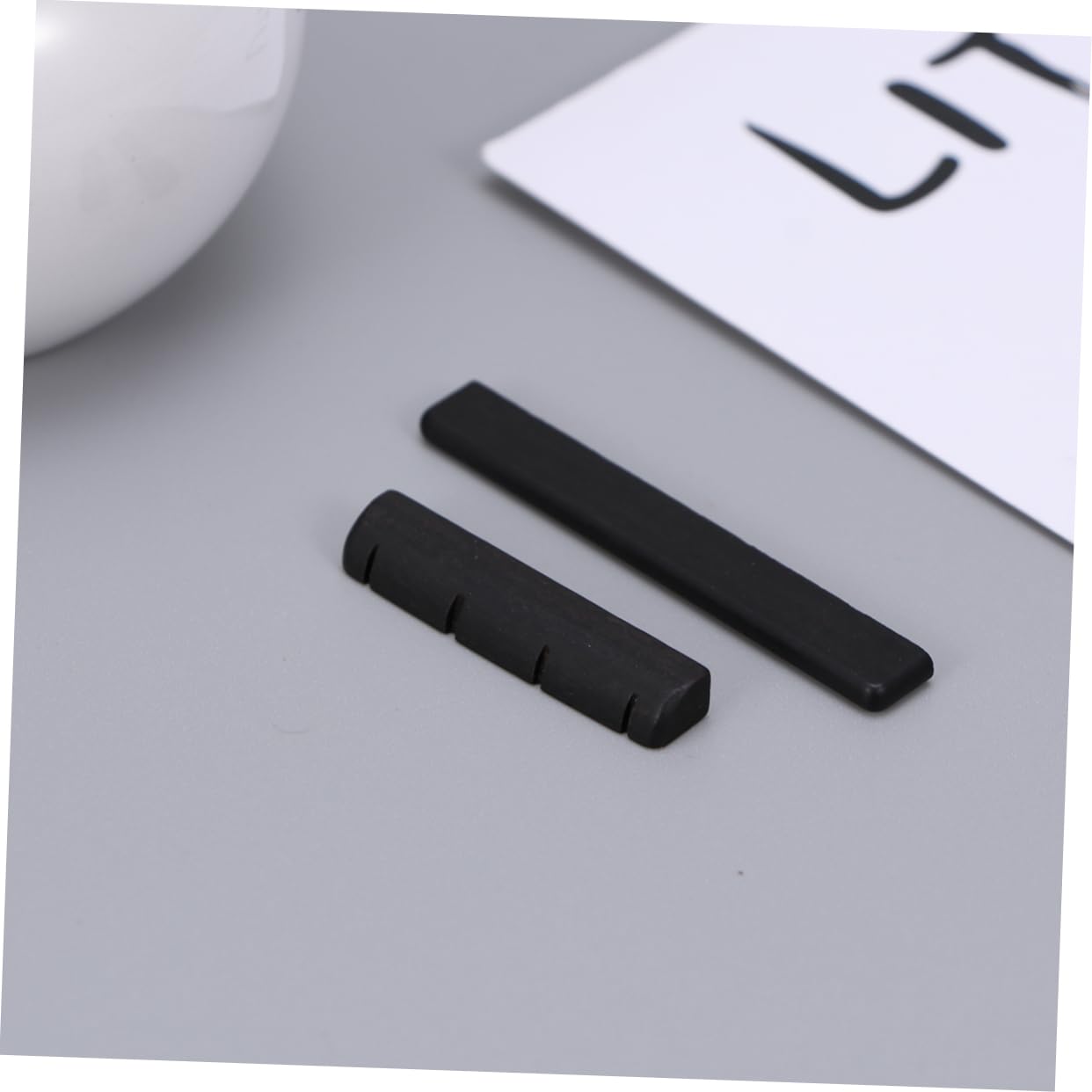 BESPORTBLE 4 Strings Ebony String Ukulele Guitar Replacement Bridge Saddle and Nut Kit Durable Guitar Accessory for Easy Playability and Enhanced Sound Quality