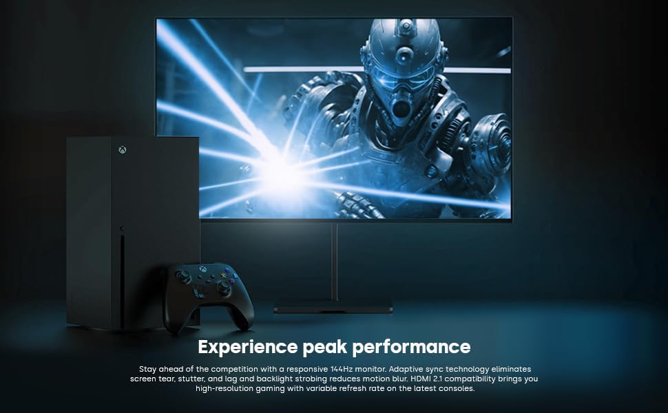 Dough Spectrum One monitor displaying a futuristic game scene next to an Xbox console and controller