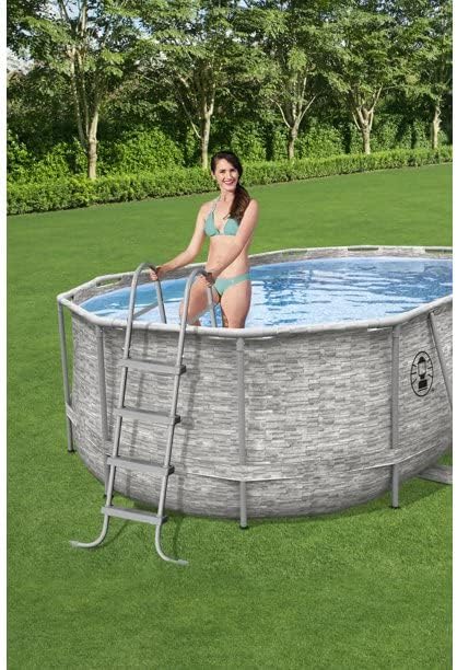 Woman using pool ladder