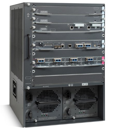 Front view of the Cisco 6509-E Switch Chassis with multiple module slots and power supply bays.