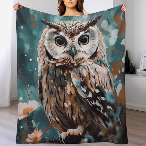 Couverture microfibre hibou pour des soirées cocooning sur le canapé