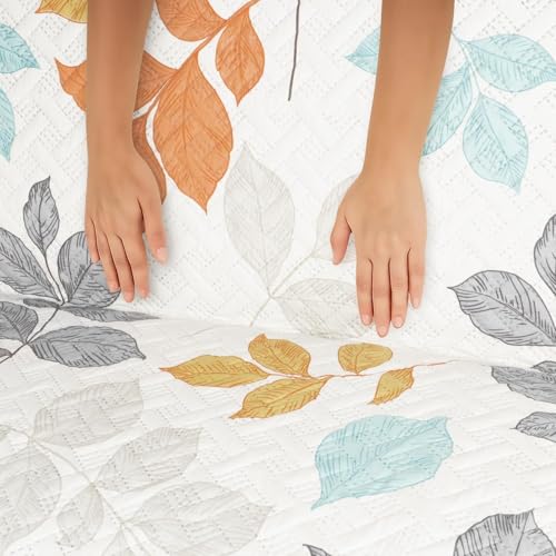 Image of Printed Quilted Sofa Mat for 5 Seater (3+1+1) - Floral Design Slipcover with Armrest, Pockets on Both Sides, Fully Covered Sofa Protector - Orange Grey