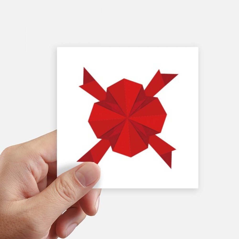Décoration de Noël origami avec cet autocollant rouge 10cm pour personnaliser valise et moto