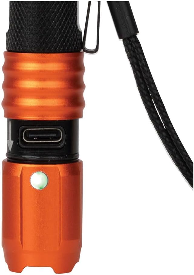 Close-up of the flashlight's charging port and battery indicator light.