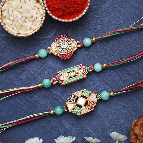 Image of eCraftIndia Set of 3 Rakhi Combo Hamper | Om Krishna Peacock Feather Lord Ganesha Silver Religious Designer Rakhis | Roli Chawal Pack