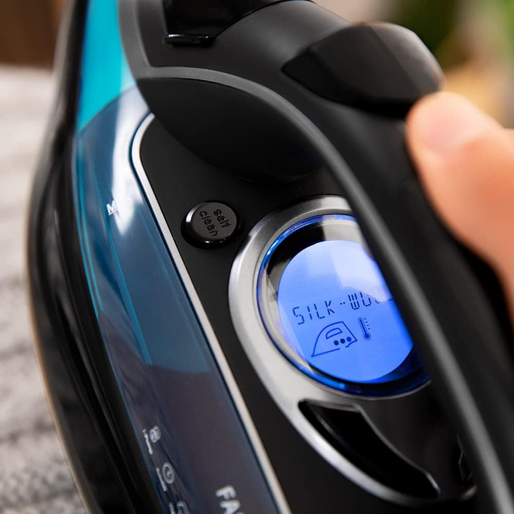 Close-up of the iron's LCD screen displaying fabric settings