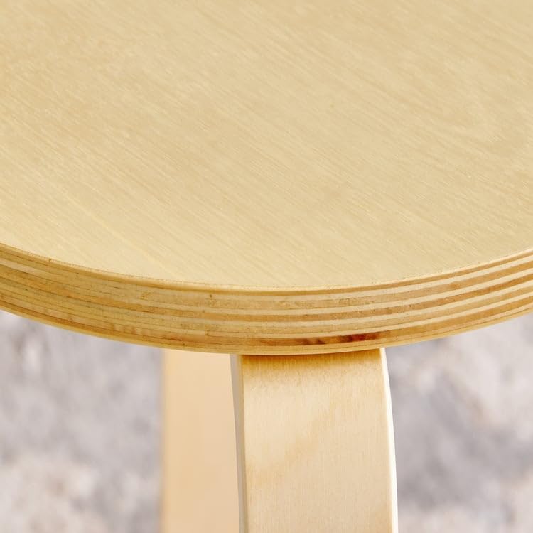 Close-up of the stool's seat edge showing layers of birch and poplar veneer