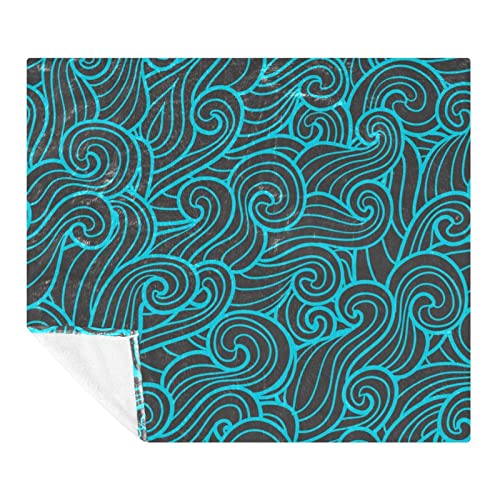 Couverture douce motif vagues pour cocooning sur canapé et voyage