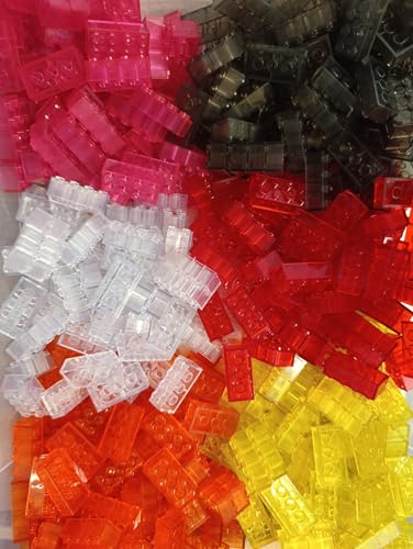 Mattoncini nei colori bianco, nero, rosa, arancione, giallo, rosso, ideali per stimolare la creatività e il pensiero spaziale.