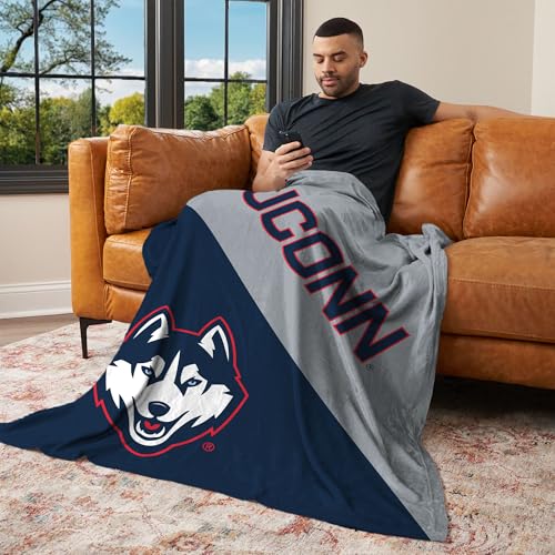 Northwest NCAA Connecticut Huskies Halftone Silk Touch Throw Blanket, Ultra Soft Plush Polyester, Lightweight Warm Decorative Fan Gift, 46 x 60 in by Northwest - Used condition - Image 3