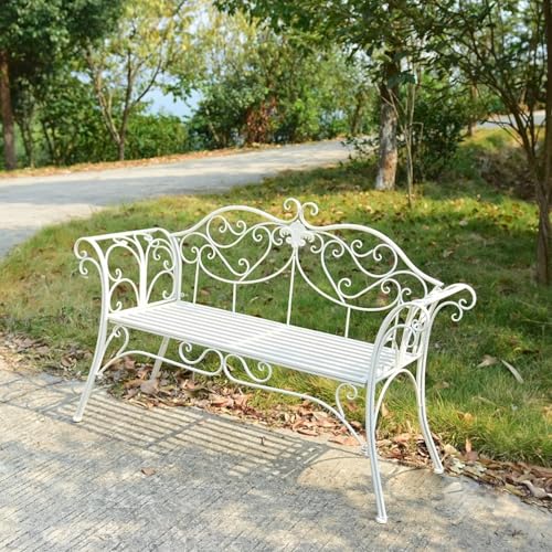 Banc de patio en fer forgé blanc pour aménager un coin lecture au jardin