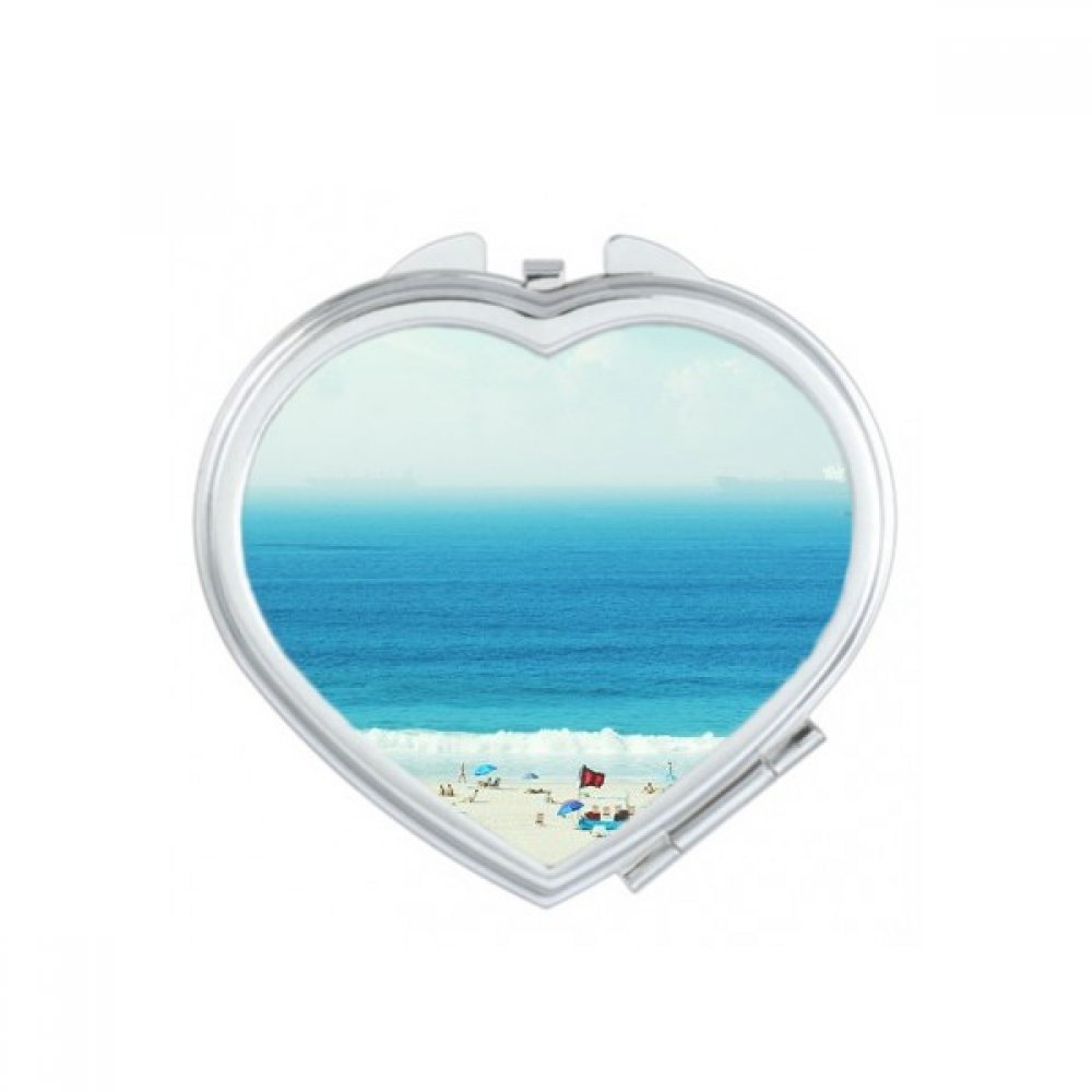 Miroir compact de poche cœur pour retoucher son maquillage facilement en déplacement