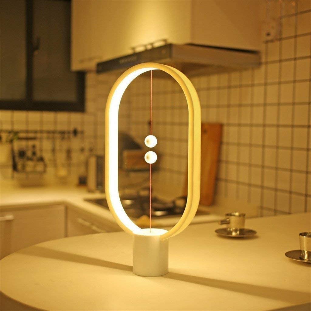 Lampe de table magnétique Heng Balance High-Tech Simple Creative Intelligent LED Balance Lampe de bureau à interrupteur magnétique à moitié vide, avec port de charge USB Bureau Chambre d'enfant