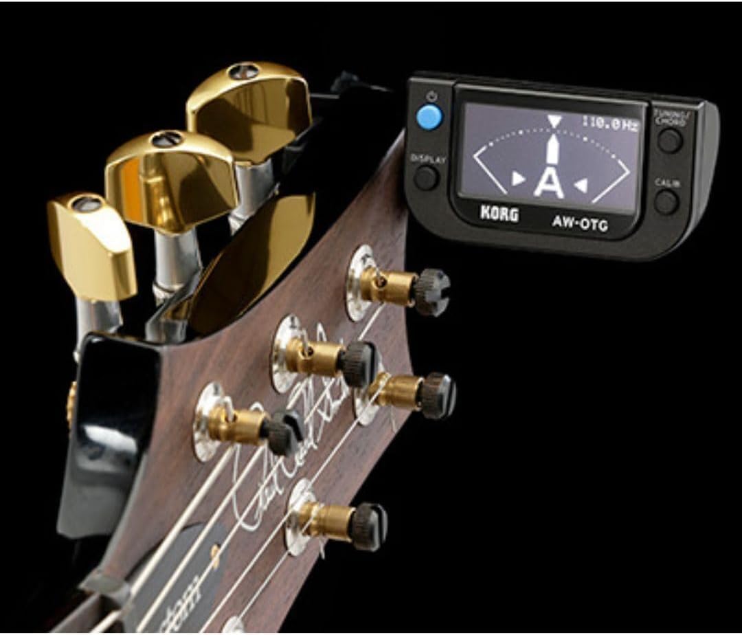 Korg AW-OTG Clip-On Guitar Tuner securely clipped to a guitar headstock