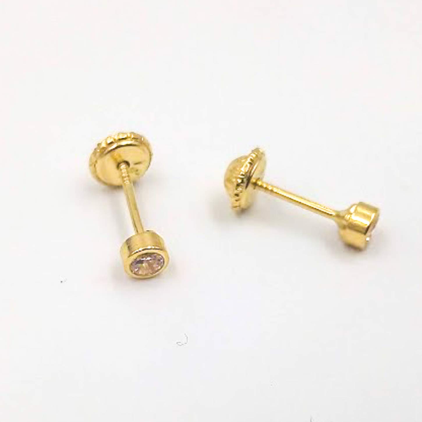 Pendientes oro amarillo de 1ª Ley de 18 Kilates de niña primera postura bisel con circonita en el centro con estupendo cierre de tornillo de tuerca. Peso real: 0.50gr