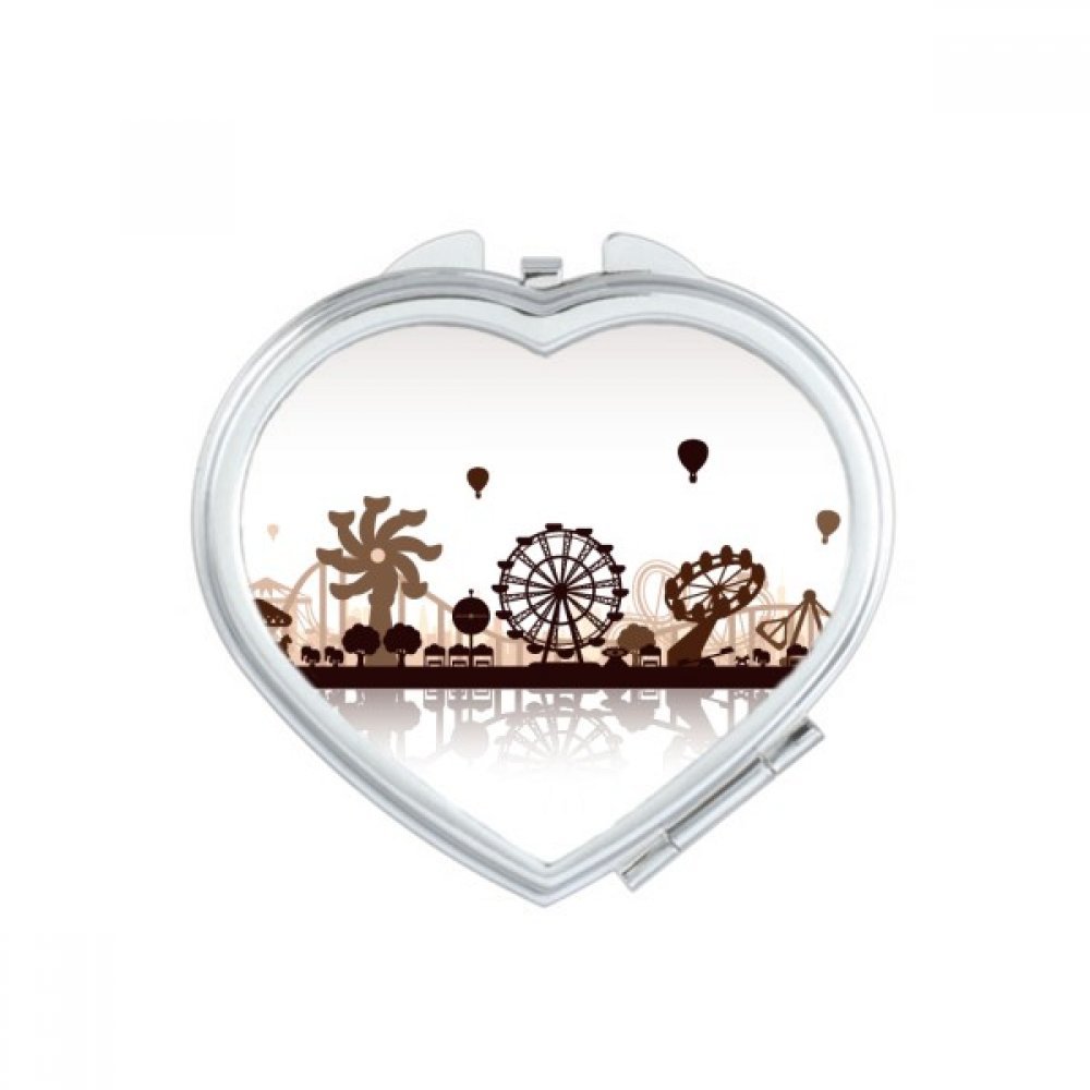 Miroir compact maquillage parc d'attractions pour retouches en voyage