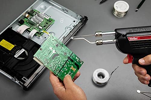 Person soldering a circuit board with the Weller D550