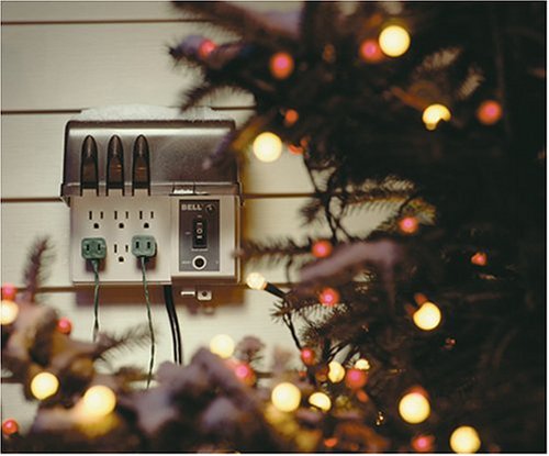 Hubbell FB3003 power strip with multiple plugs connected, powering outdoor Christmas lights.