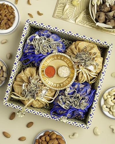 Image of Hyperfoods Rakhi Hamper for Brother Rawfruit's Handcrafted Potli Blue with Thali Roli & Rice Dry Fruits Pack of 4 Almond Cashew Raisins Pistachios 495 Gr Rakhi with DryFruits
