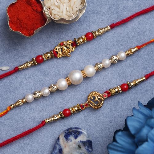 Image of eCraftIndia Red & Golden Set of 3 Trishul with Damru, Lord Ganesha, & Lord Krishna Playing Flute Religious Rakhis with Roli Chawal Pack
