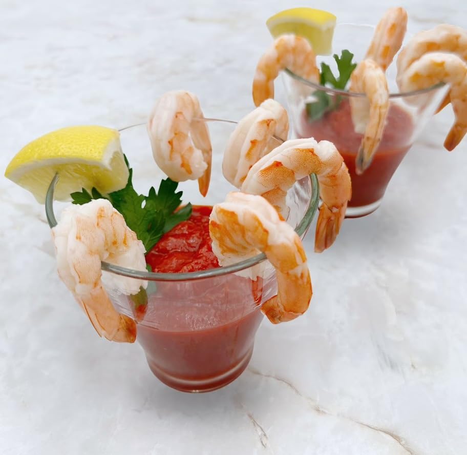 Shrimp Tray with Cocktail Sauce, Shrimp and zesty cocktail sauce in a party ready tray,It’s accompanied by fresh lemon wedges, adding a tangy twist to the dish. 1.5 POUND