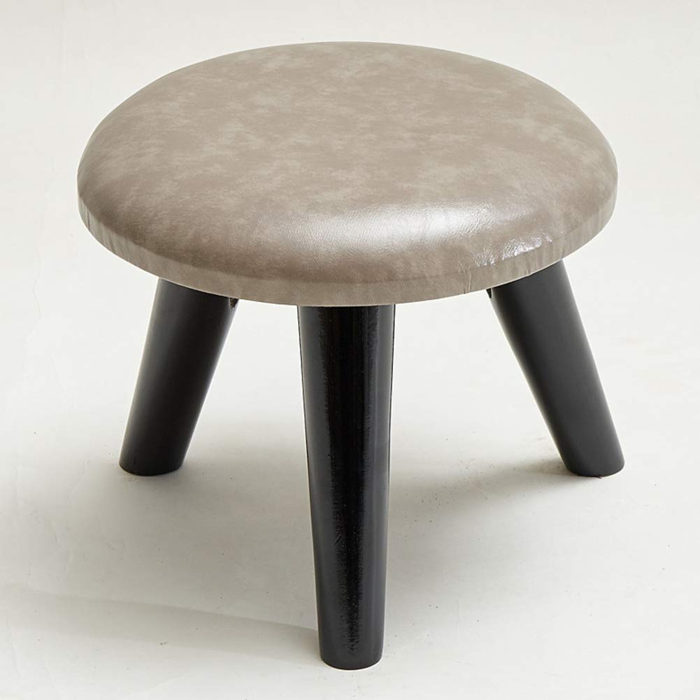 Pouf repose-pieds en bois pour créer un coin lecture cosy dans le salon