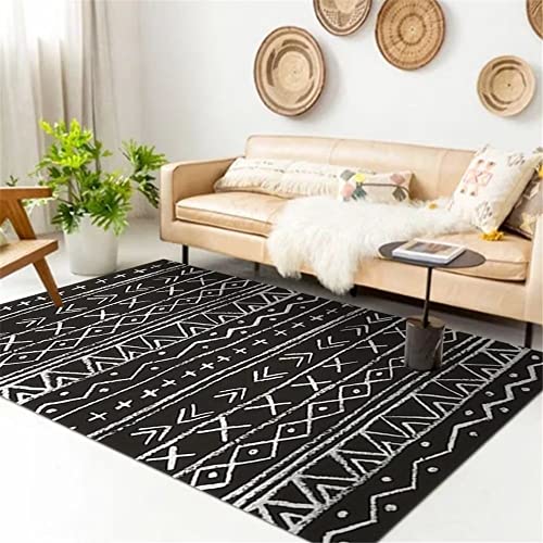 Grand tapis salon durable noir aux lignes de pliage géométriques épurées