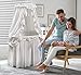 Badger Basket Majesty Canopy Bassinet, Rocking Baby Cradle Bed with Mattress, Bedding, and Storage, Oval White/White