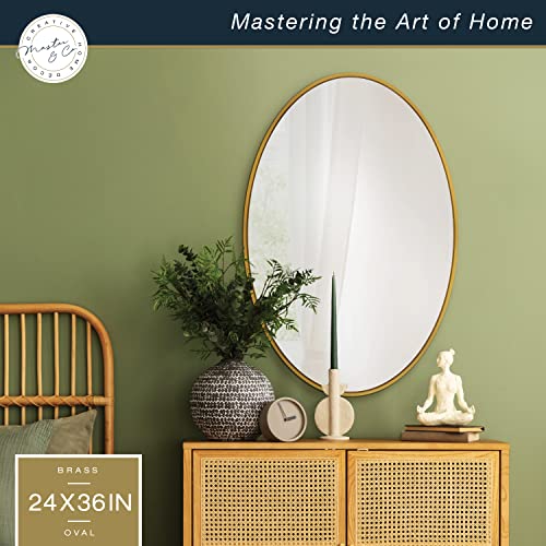 Image of MCS Master & Co. Modern Metal Large Wall Mirror, Minimalist Home Decor Oval Mirror for Living Room, Bedroom, or Bathroom, 24 by 36 Inch, Brass