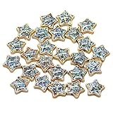 25 cabujones de estrellas doradas con purpurina iridiscente.