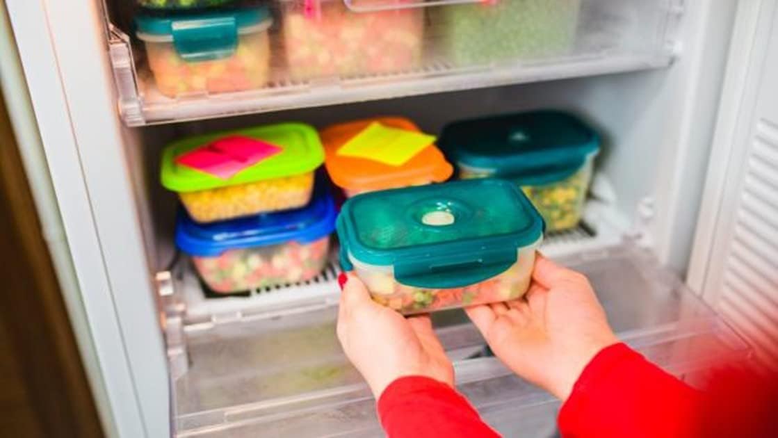 Refrigerator interior with various food items in containers