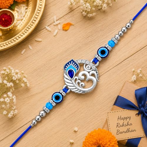 Image of Riddhika Ventures Religious Meenakari Om and Peacock Feather Rakhi With Roli Chawal And Greeting Card