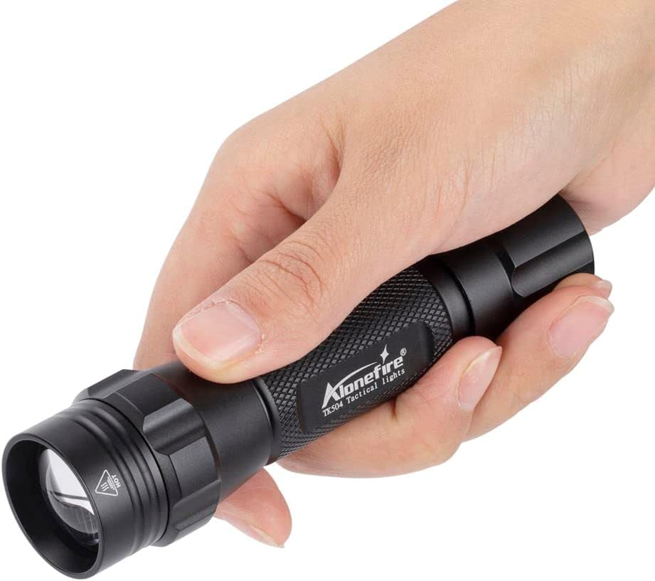 ALONEFIRE TK504 IR Flashlight held in hand