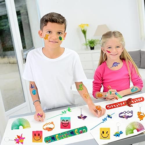 Chennyfun 74 PCS Dinosaur Party Bag Fillers for Kids Stocking Filler Toy Assortment With Rainbow Springs, Slap Bands, Keychains, Temporary Tattoos Birthday Balloon Party Favours Toys Gifts for Kids
