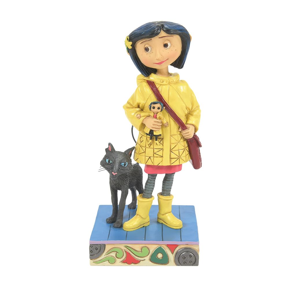 Figurine Coraline Enesco par Jim Shore en imperméable jaune de 16 cm