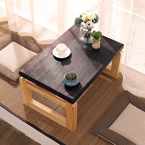 Table basse pliable bois marron pour optimiser un studio