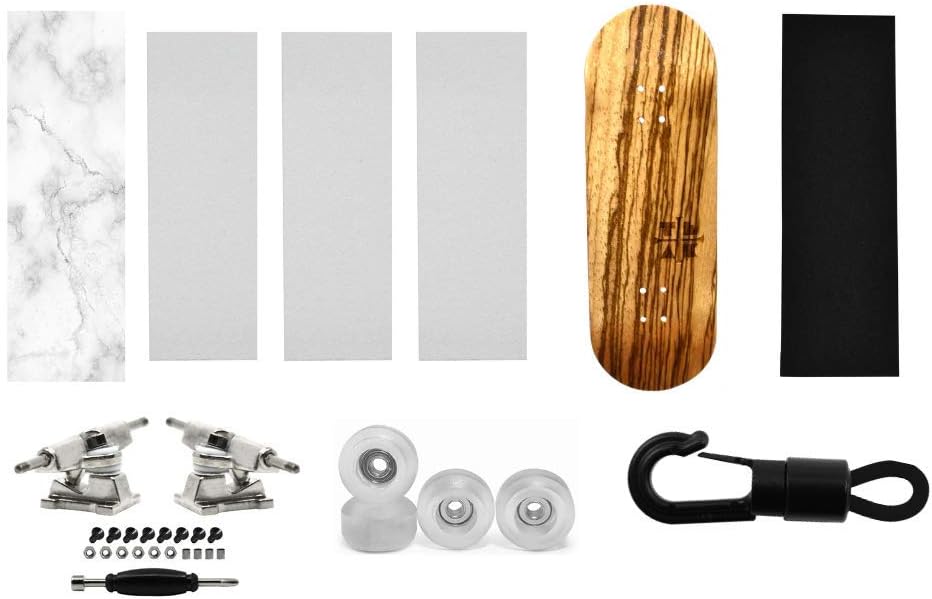Teak Tuning Fingerboard Starter Set No. 4 - Includes Zebrawood Fingerboard Deck, 1 Deck Graphic Wrap, 3 Pieces of Skate Grip, 1 Piece of Trick Tape, Set of Silver Trucks, Clear Wheels, and a Carrier