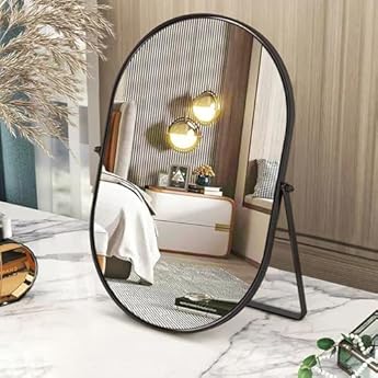 Foto di Specchio da trucco ovale girevole con struttura in metallo, nero, su un lato, specchio portatile da banco per toeletta, soggiorno e camera da letto