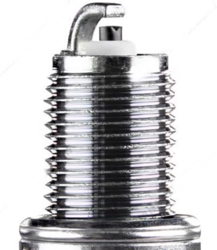 Close-up view of the NGK spark plug's ground electrode and center electrode.