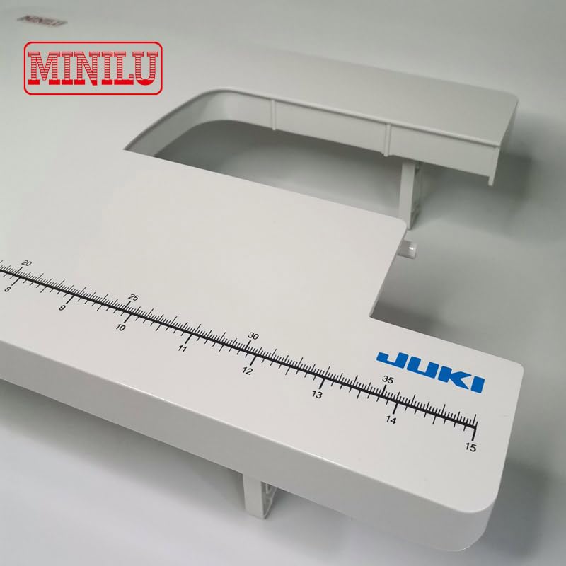 Жакын план view of the measurement markings on the Phicus sewing machine extension table.