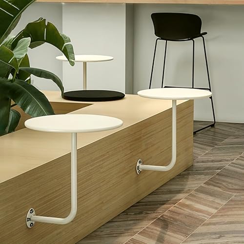 Table basse ronde murale pour optimiser les studios et petits salons