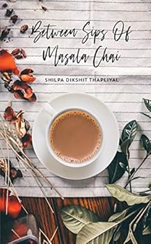 Paperback Between Sips of Masala Chai : Poems Book