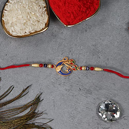Image of Oblivion Peacock Mor and Mahadev Trishul Rakhi Pair for Brother with Silver Colour Pooja Thali, Roli Chawal, Coin and Greeting Card