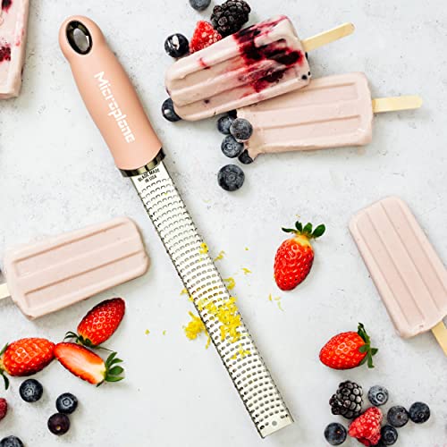 Image of Microplane Zester Grater in Dusty Rose for Citrus Fruits, Hard Cheese, Ginger, Chocolate and Nutmeg with Fine Stainless Steel Blade - Made in USA